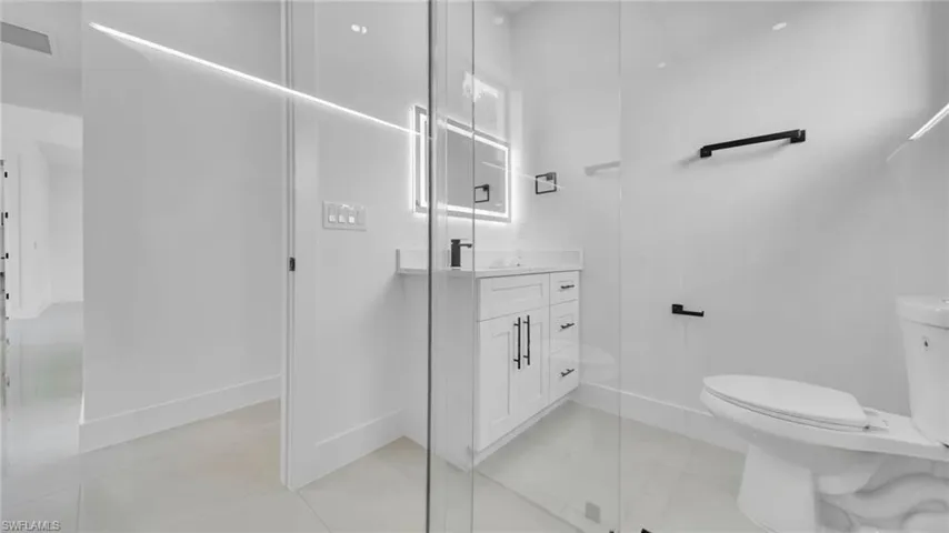 Full bath with toilet and vanity