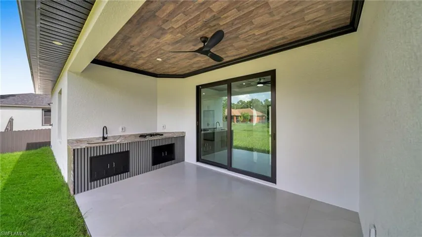 View of patio / terrace featuring ceiling fan and area for grilling