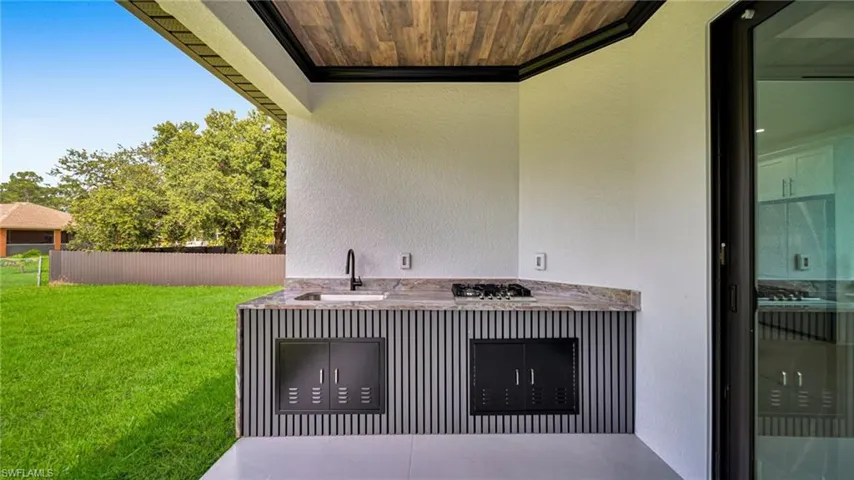 View of patio / terrace with a sink and area for grilling