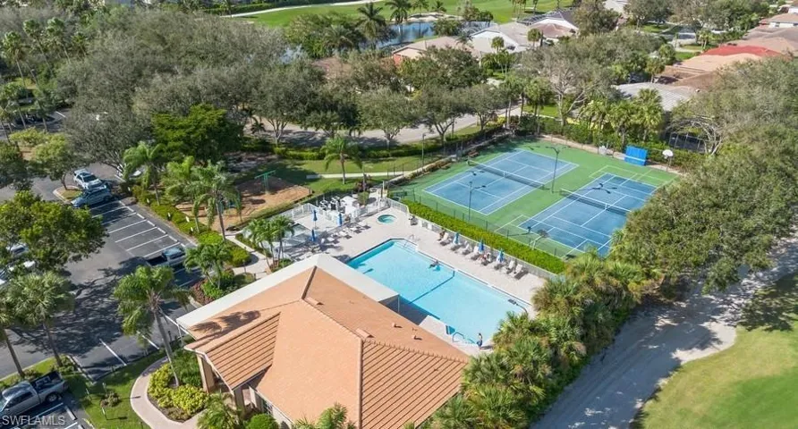 Bird's eye view of Heritage Greens Community Pool, club house, tennis & pickleball courts