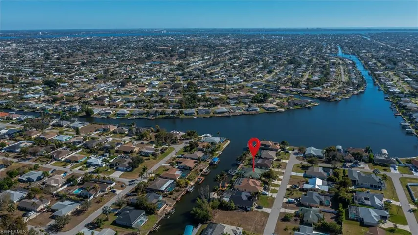 View of property location featuring nearby suburban area and a nearby body of water