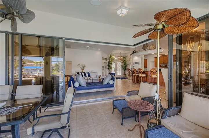 View of patio with ceiling fan and outdoor lounge area