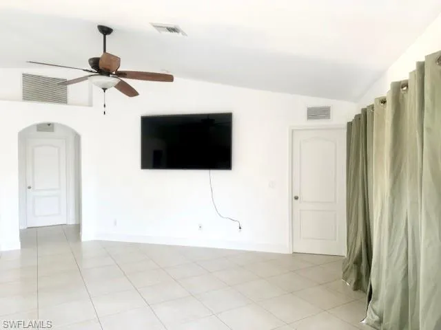 Bask in natural light in this stunning open-concept living area. Oversized windows create a bright, airy atmosphere, seamlessly connecting the heart of the home for effortless entertaining and modern living.