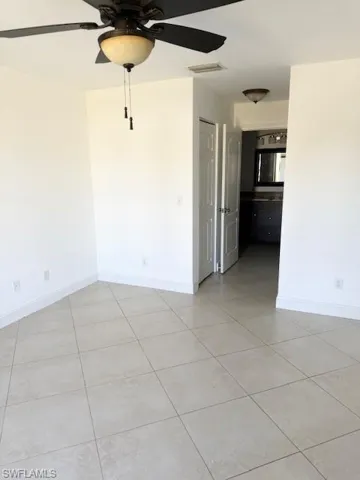 The primary suite offers a bright and inviting retreat, filled with natural light and designed for comfort. It features a spacious ensuite bathroom and two walk-in closets, providing ample storage and a functional, well-balanced layout.