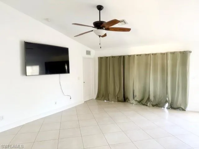 Bask in natural light in this stunning open-concept living area. Oversized windows create a bright, airy atmosphere, seamlessly connecting the heart of the home for effortless entertaining and modern living.