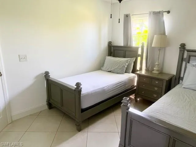 The third bedroom features a comfortable, well-sized layout with sleek tile flooring and great natural light. Complete with a spacious closet, it offers a bright and versatile space