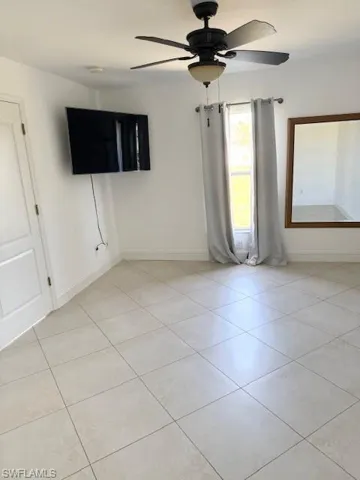 The primary suite offers a bright and inviting retreat, filled with natural light and designed for comfort. It features a spacious ensuite bathroom and two walk-in closets, providing ample storage and a functional, well-balanced layout.