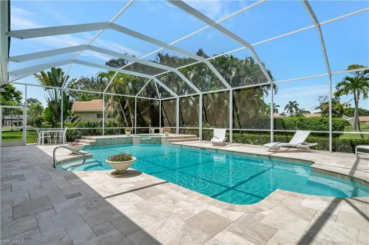 large stone patio with exceptional pool and spa