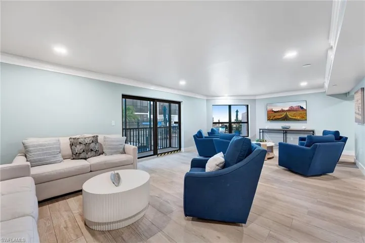 Community Living area featuring light wood-style floors, crown molding, and recessed lighting