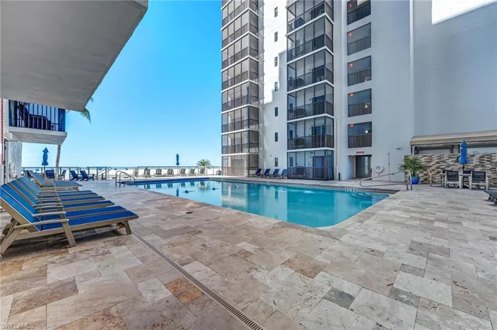 Community pool with a patio area
