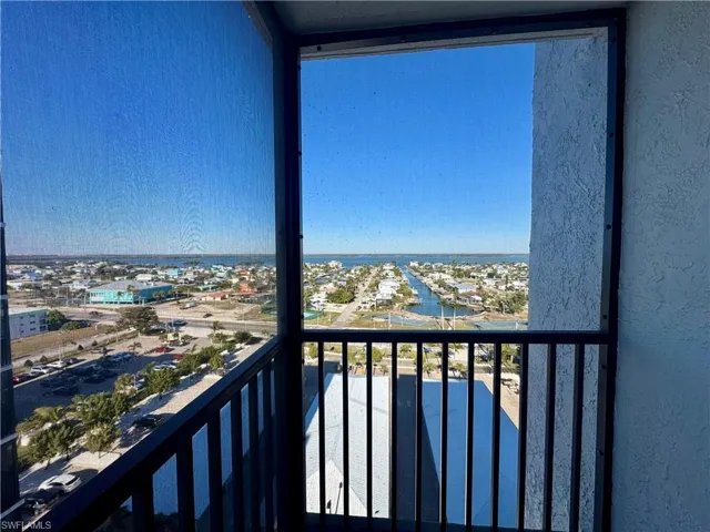 Balcony with a view over the carports out to the canal front dock and view down to the Bay from the Master bedroom balcony