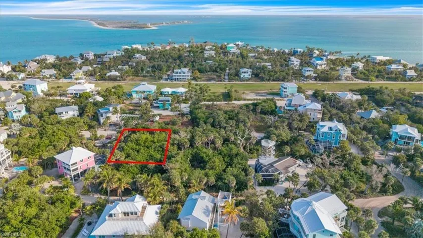 Aerial view of lot (outlined in red) nestled among established island homes — just a short walk to the North Captiva airstrip and surrounded by the island's most desirable residential neighborhood.
