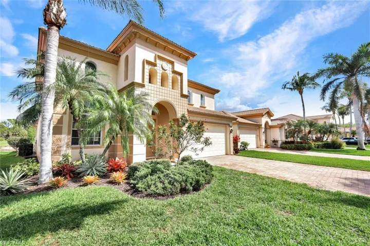 Beautiful front exterior with lush landscaping and excellent curb appeal.