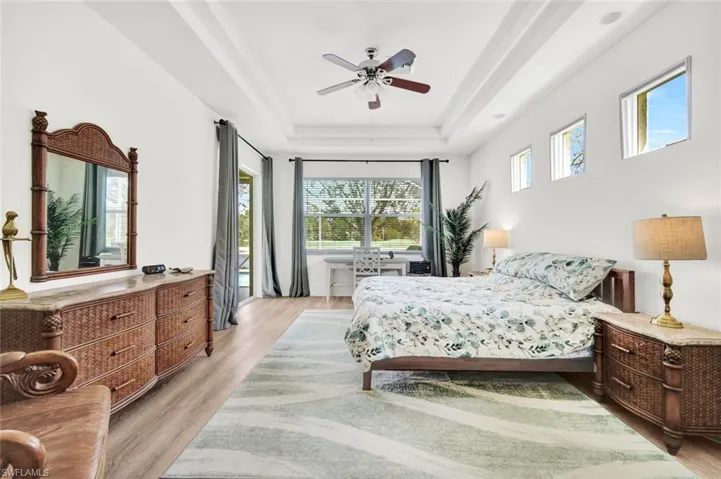 The luxurious primary suite privately located on the first floor, with direct lanai access.