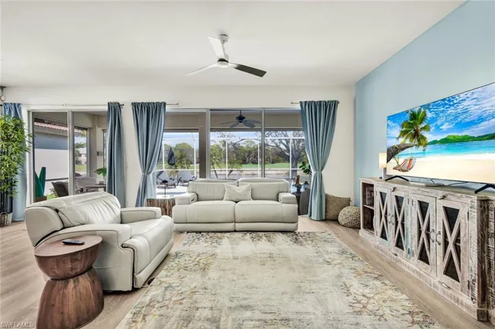 The family room provides easy access to the covered lanai and pool area.
