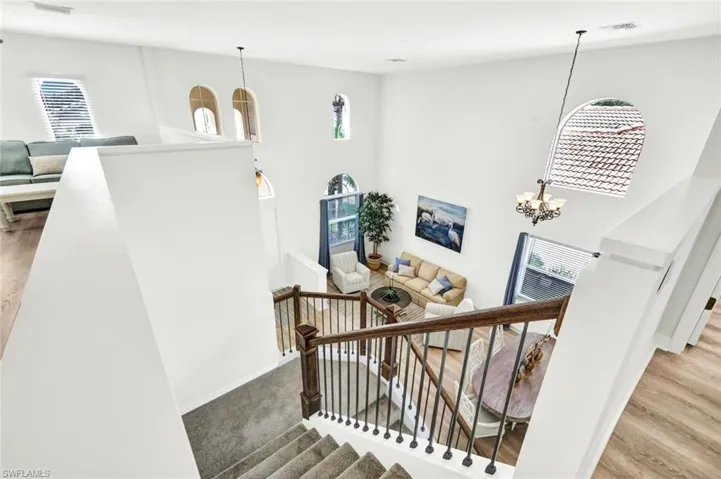 Cathedral ceilings and arched windows add to the grand feel of this home.