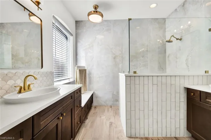Modern and sophisticated primary ensuite bathroom.