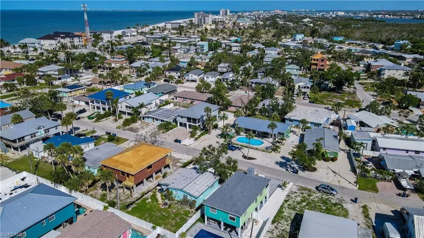 Birds eye view of property with a water view