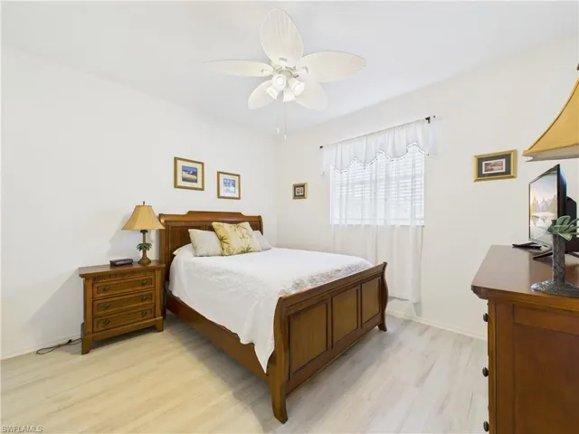 Bedroom featuring light wood finished floors and a ceiling fan