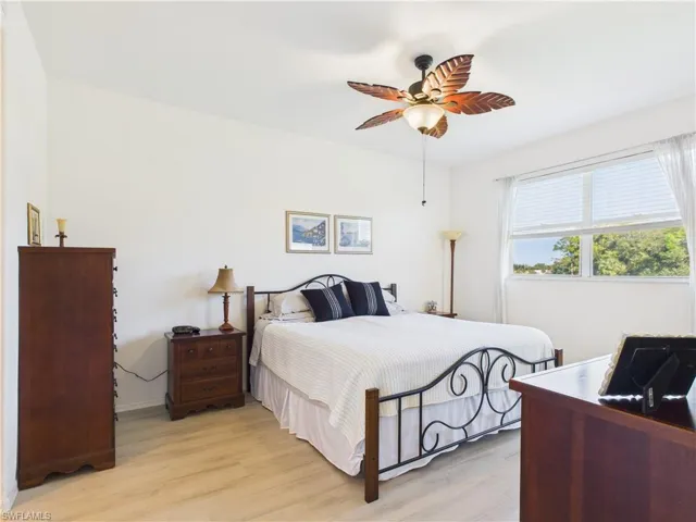 Bedroom featuring light wood finished floors and a ceiling fan