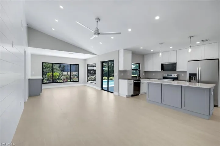 Home features an open floor plan, vaulted ceilings and gorgeous finishes!