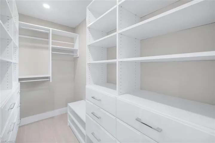 Primary bedroom features a large custom closet.