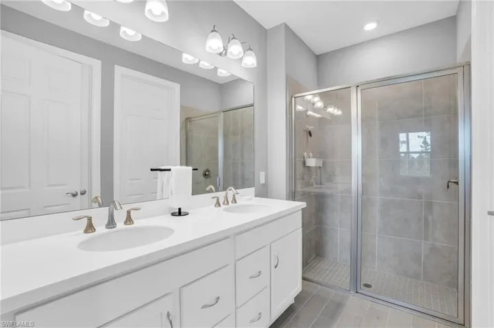 Bathroom featuring vanity and walk in shower
