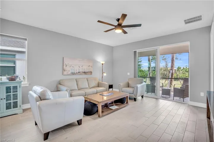 Living room featuring ceiling fan