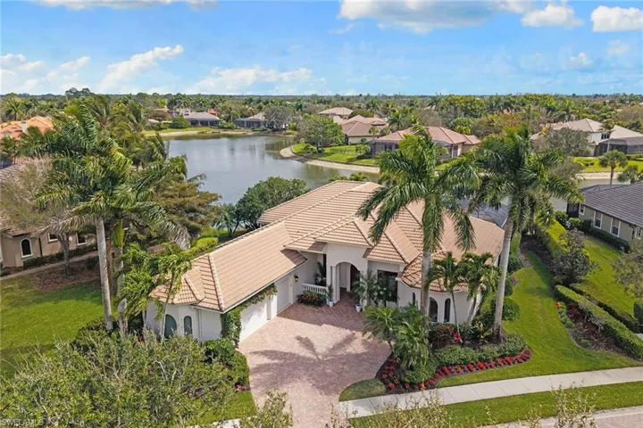 Aerial view of residential area featuring a large body of water