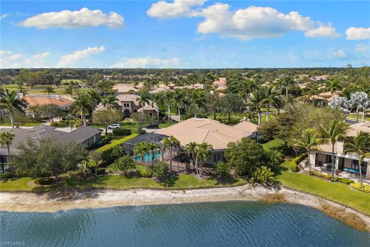 Aerial view of residential area featuring a large body of water