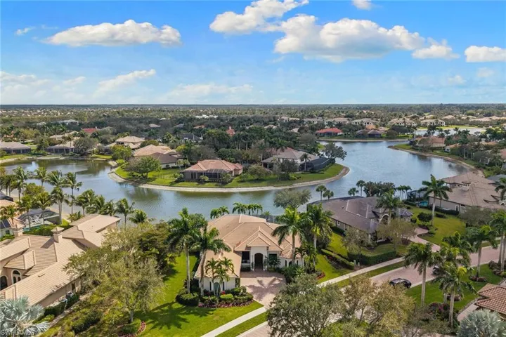 Aerial perspective of suburban area with a large body of water