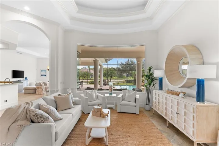 Living room with a high tray ceiling and crown molding