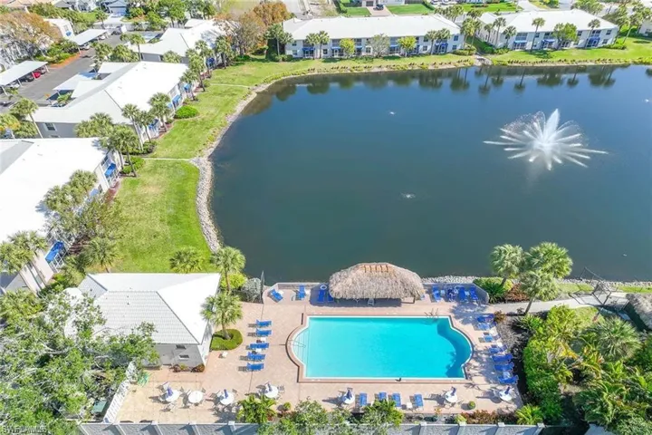 Bird's eye view of a pool area and a large body of water