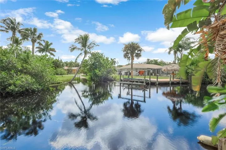 View of water feature with a dock