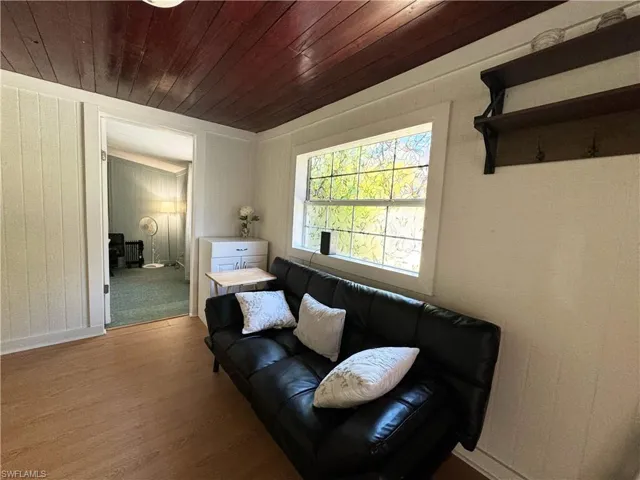 Sitting room featuring wood finished floors and wooden ceiling