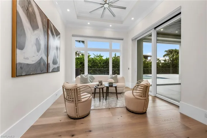 Main bedroom sitting area w pool & spa view