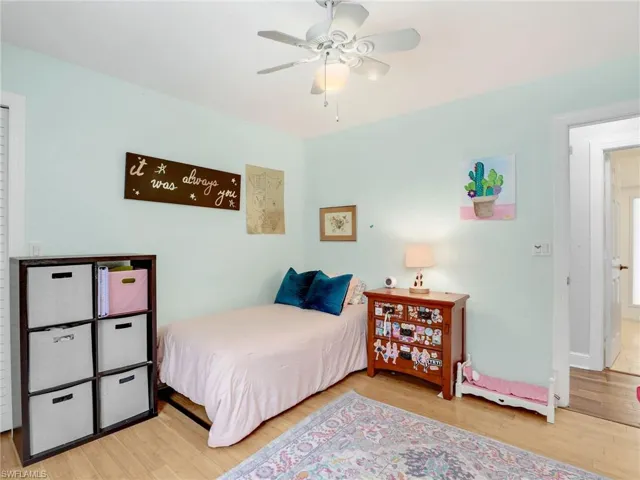 Bedroom featuring wood finished floors and ceiling fan