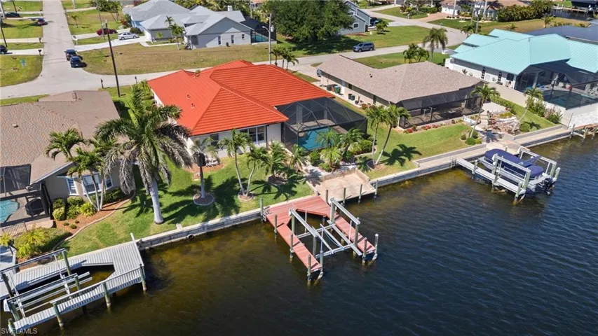 Drone / aerial view featuring a water view and a residential view