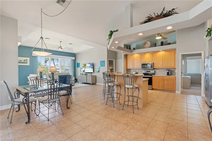 Kitchen featuring a ceiling fan, baseboards, appliances with stainless steel finishes, and visible vents