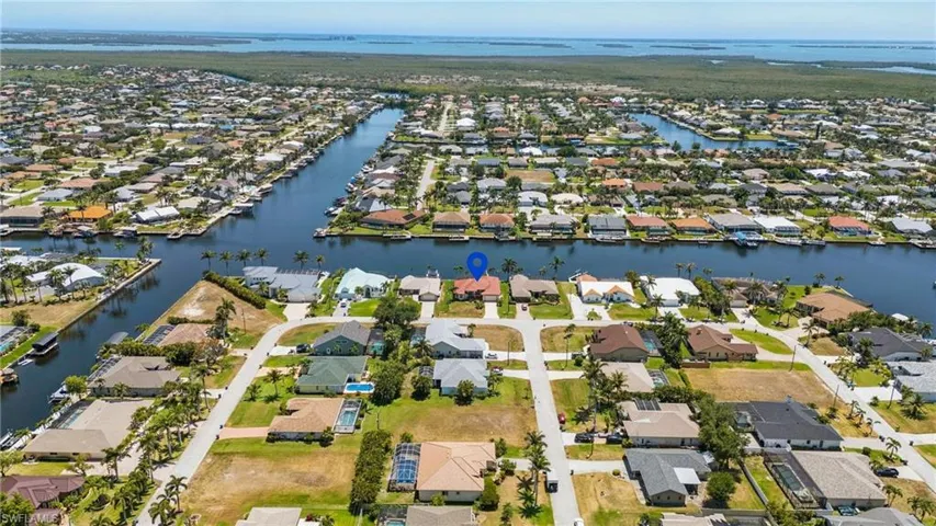 Drone / aerial view featuring a water view and a residential view
