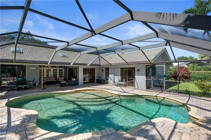 Pool with Large Paved Deck & Screen Enclosure