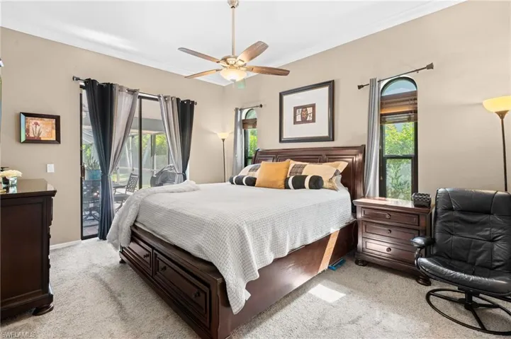Primary Bedroom with Sliders to the Pool