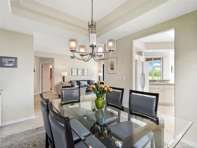 Dining Room w/ Tray Ceiling & Designer Chandelier