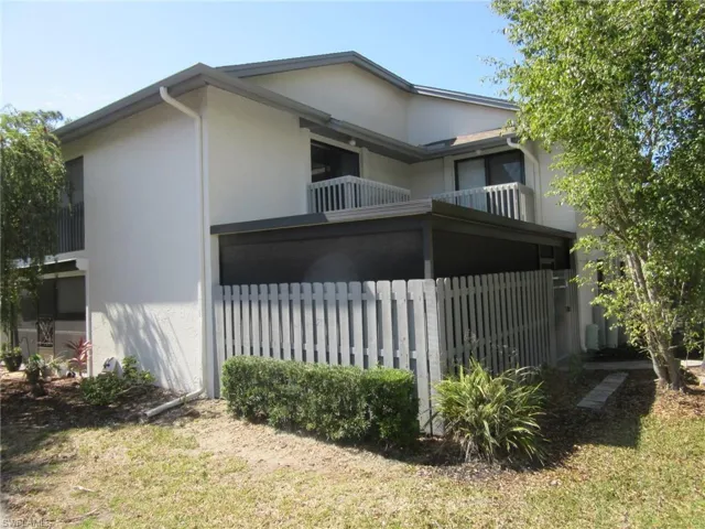 View of property exterior with a balcony and stucco siding