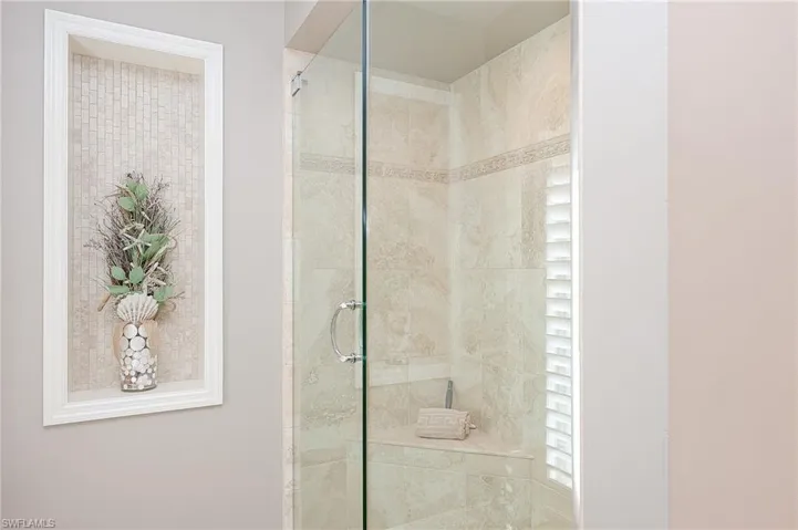 Bathroom featuring a tile shower
