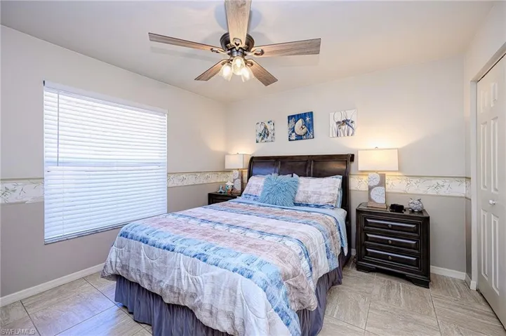 Bedroom featuring baseboards and a ceiling fan