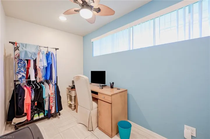 Office with recessed lighting, a ceiling fan, and baseboards