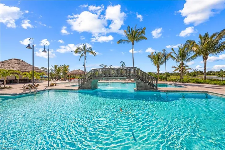 Resort style pool with overhead water bridge