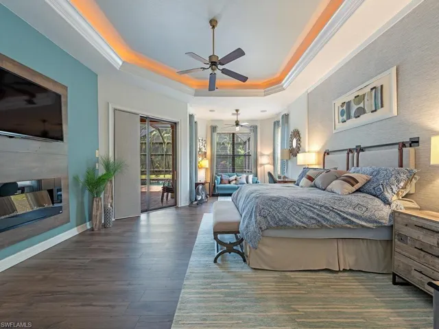 Large Primary with sitting room, ceiling fan and direct access to lanai