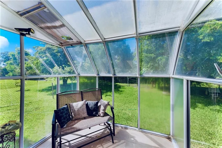 Sunroom with a water view